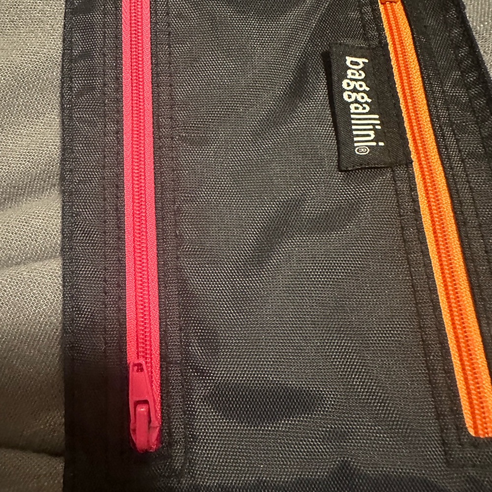 Baggallini Black Bag with Vibrant Pink and Orange Accents